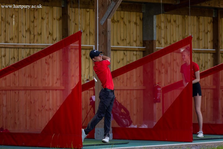 College Students On Driving Range