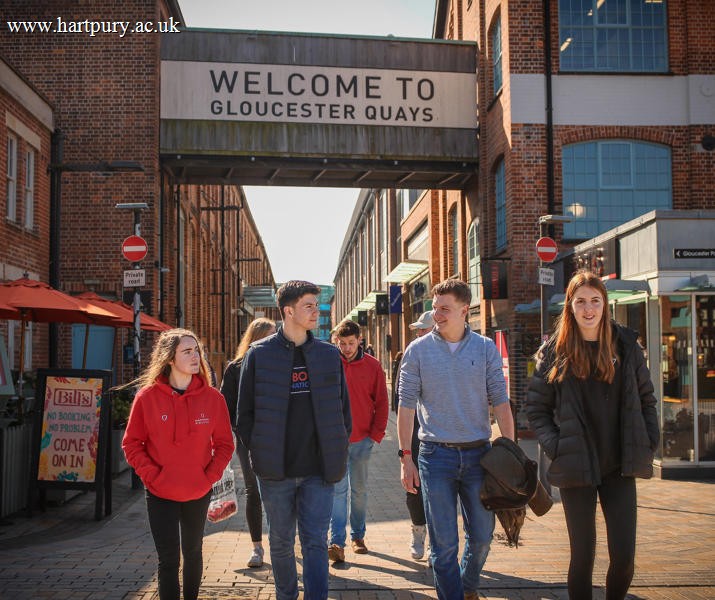 Group of students walking through Gloucester Quays