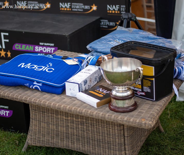 NAF Rugs And Trophy On Table