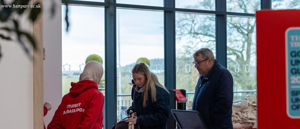 Student Ambassador Greets Guests At Open Event